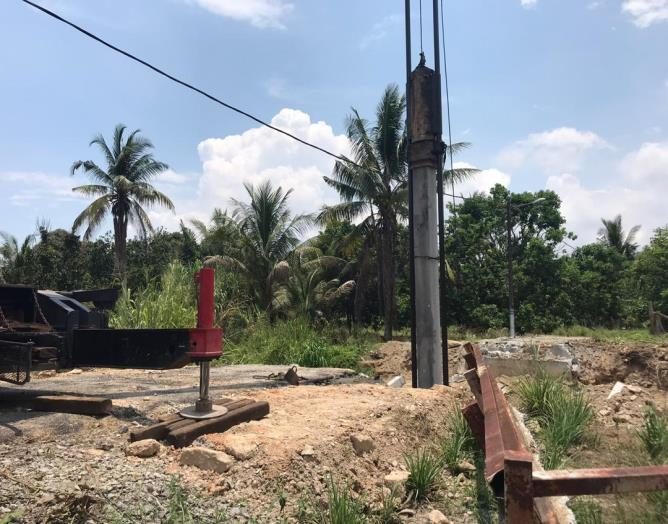Steel sheet piles along a river bank