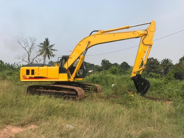 Tracked excavator on a cleared site
