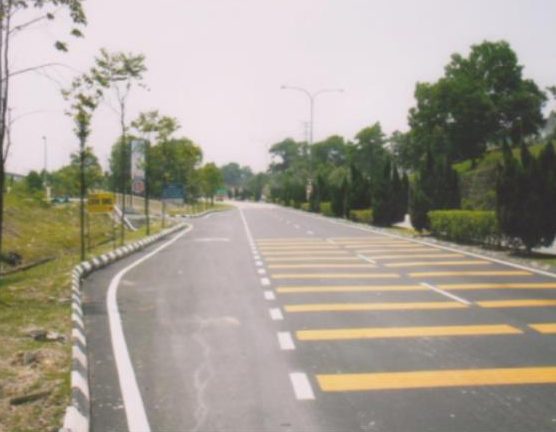 Completed road with thermoplastic line markings and kerbs